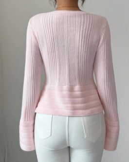 Jersey con botones peplum