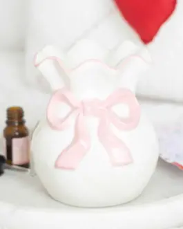 Quemador blanco lazo rosa